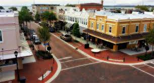 An aerial photograph of a main street in downtown Eustis, Florida. Eustis, Florida is a location served by Johannessen Lights.