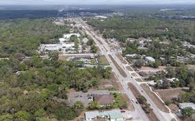 An aerial view of a main road in Orange City, Florida. Orange City, Florida is a location served by Johannessen Lights.