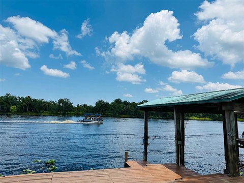 A view of the water from a wooden dock in Osteen, Florida. Osteen, Florida is a location served by Johannessen Lights.