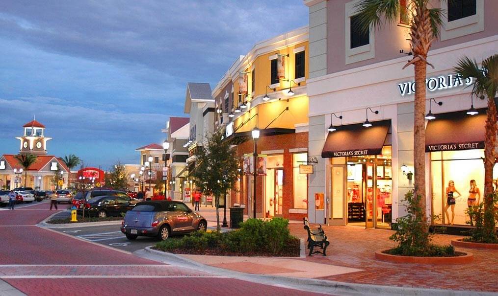 A street view of Winter Garden, Florida's shopping district taken in the evening. The shops are lit up and so is the street. Winter Garden, Florida is a location served by Johannessen Lights.